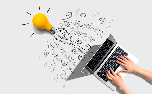 Idea light bulb flying to the sky like a rocket from a laptop computer - Flat lay 